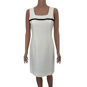 White dress with black stitched ribbon bow by Petite Sophisticate.